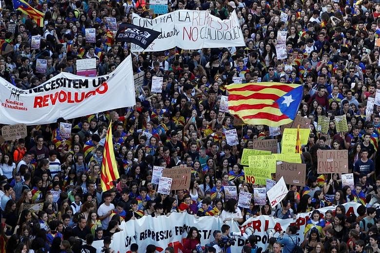 A protest in Barcelona yesterday. Violence in Catalonia erupted on Monday, after Spain's Supreme Court handed down long prison terms to nine Catalan leaders for their role in the failed independence bid in 2017.