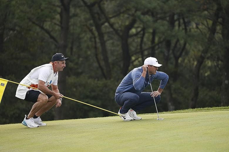 Brooks Koepka lining up his shot during the first round of the CJ Cup at the Nine Bridges Golf Club in Jeju. The world No. 1 is tied for 15th after a mixed round. PHOTO: EPA-EFE
