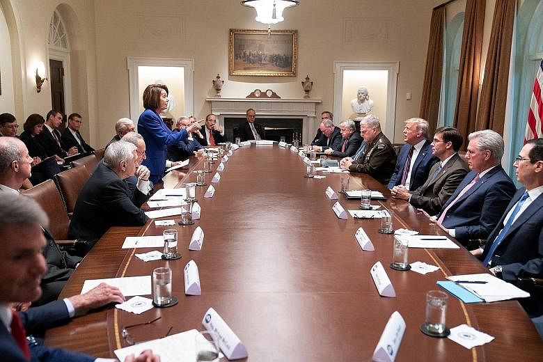 House Speaker Nancy Pelosi facing off against President Donald Trump on Wednesday, before cutting short the meeting on the situation in Syria following Mr Trump's decision to pull US forces out of the country. PHOTO: THE WHITE HOUSE/TWITTER
