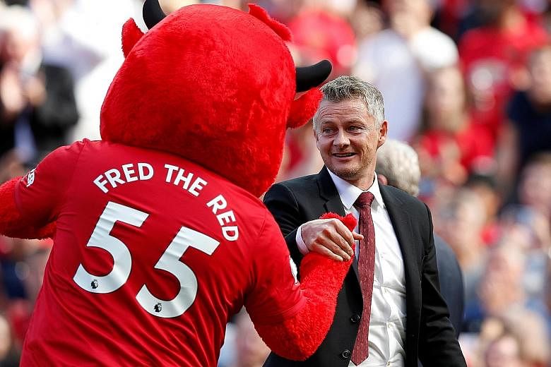 Manchester United manager Ole Gunnar Solskjaer and the club mascot before a match at Old Trafford. 