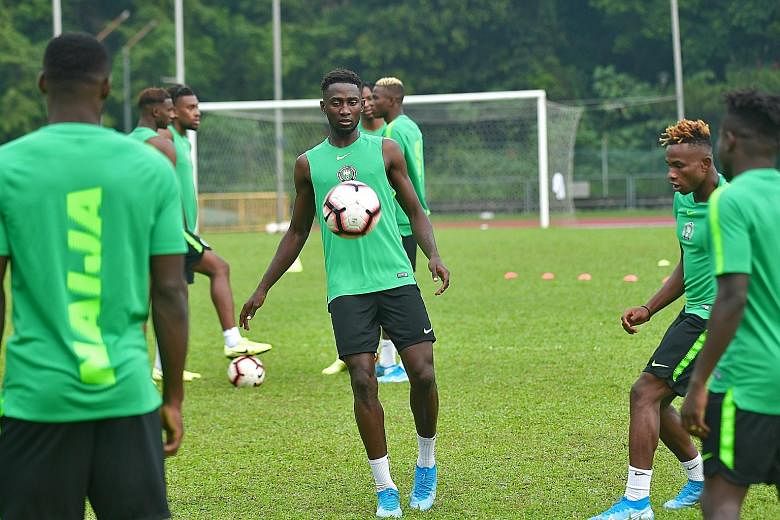 Wilfred Ndidi training with his Nigerian teammates at Bukit Gombak Stadium before their friendly against Brazil. The tough-tackling midfielder has played a key role in Leicester's fine start to the season. 