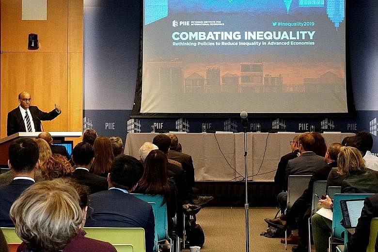 Senior Minister Tharman Shanmugaratnam speaking at the Peterson Institute for International Economics' conference on Thursday. He and Bank of England governor Mark Carney received the Institute of International Finance's first Distinguished Leadershi