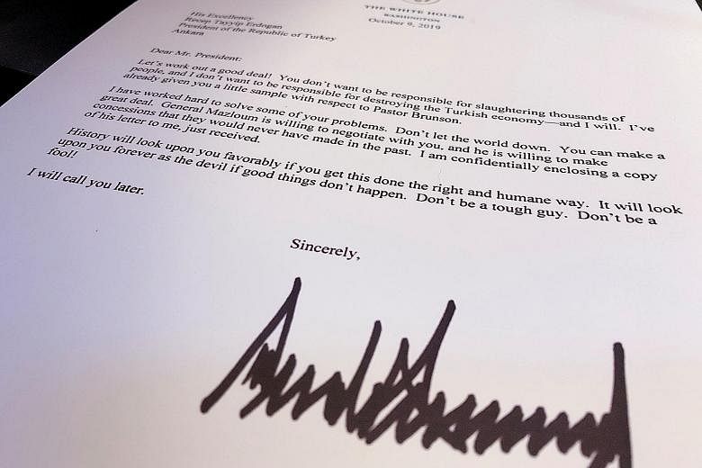 US President Donald Trump's Oct 9 letter to him was not in line with "political and diplomatic courtesy", said Turkish President Recep Tayyip Erdogan. Turkish media reported Mr Erdogan had "binned" the letter. PHOTO: REUTERS