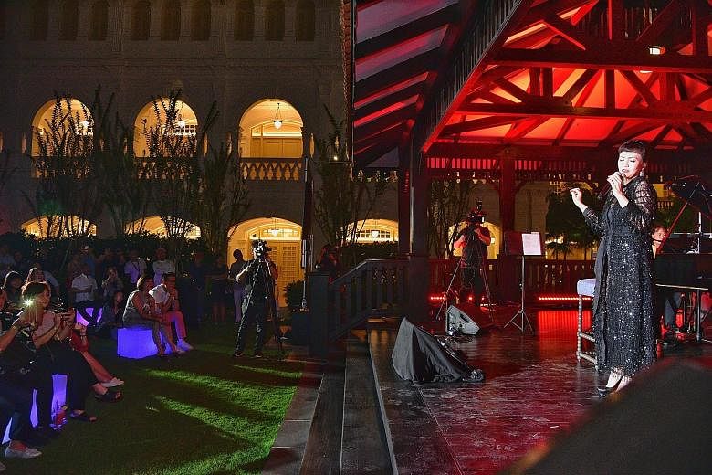 Above: Dancers performing outside Raffles Hotel as part its official unveiling last night. Right: Kit Chan singing at The Lawn of Raffles Hotel. Others who provided live entertainment included indie-pop band The Sam Willows, singer and songwriter Inc