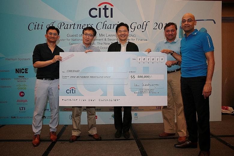 (From left) ChildAid 2019 co-chair Helmi Yusof, Business Times editor Wong Wei Kong, National Development Minister Lawrence Wong, Citi's chief information officer and head of operations and technology for Asia-Pacific Vikram Subrahmanyam and Citi's h