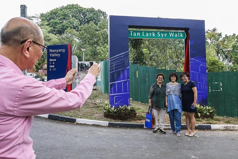 Alumni members taking photos yesterday at the newly renamed Tan Lark Sye Walk. Mr Tan Lark Sye had played a key role in setting up Nanyang University. The building that houses Nanyang Technological University's College of Humanities, Arts and Social 