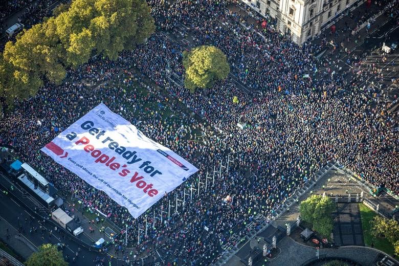 An aerial view of a section of the crowd of thousands who marched to Parliament Square in London on Saturday demanding a people's vote on the Brexit deal. PHOTO: REUTERS
