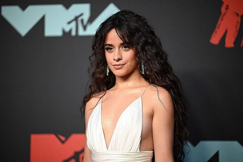 IN LOVE WITH A QUOKKA: Recent rumours of a break-up between Canadian singer-songwriter Shawn Mendes and his girlfriend, fellow singer Camila Cabello (right), have not dampened Mendes' mood for a little fun. On Sunday, the 21-year-old took a selfie (l