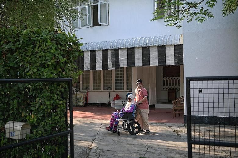Mr Barkath Ali Abu Bakar and his grandmother Hasana Ahmad at her house in Jalan Binjai earlier this month. Madam Hasana, who is the longest-staying resident in the Katong estate, will have to say goodbye to her home when her lease is up in December n