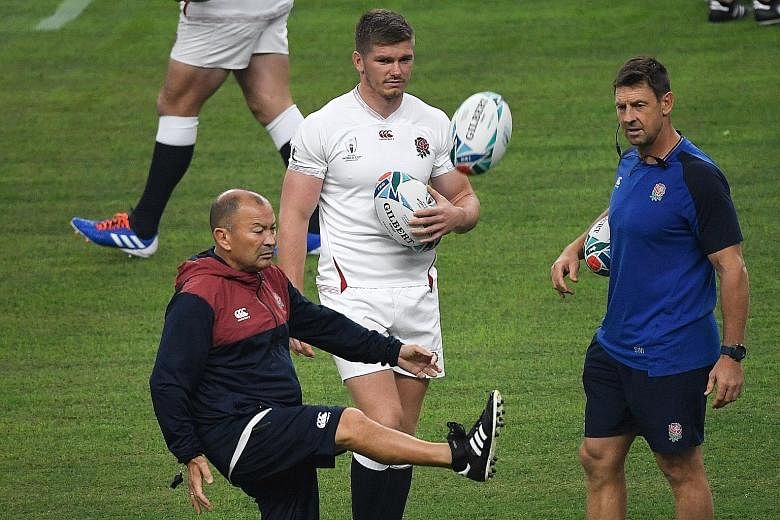 England coach Eddie Jones kicking the ball next to captain Owen Farrell during a training session ahead of last Saturday's quarter-final victory over Australia. In the semi-finals, they will take on New Zealand on Saturday while Wales face South Afri
