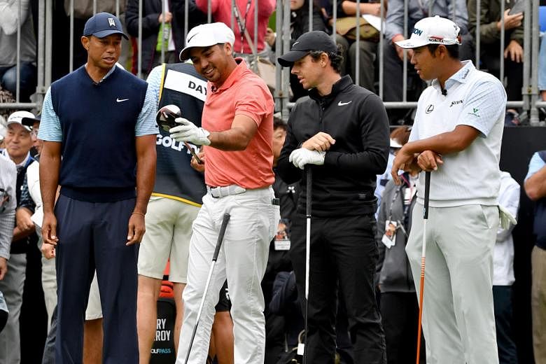 Stars galore as Tiger Woods, Jason Day, Rory McIlroy and Hideki Matsuyama have a friendly chat during The Challenge: Japan Skins yesterday. Australian Day came out on top with US$210,000.
