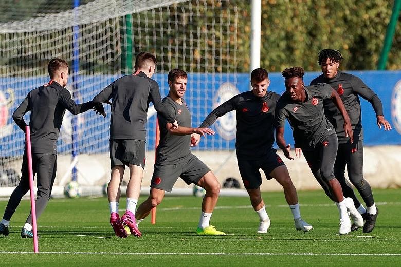 Striker Tammy Abraham, 22, (second from right) is leading Chelsea's charge this season, starting with training at the club's ground in Cobham. Frank Lampard's men take on last season's semi-finalists Ajax in the Champions League today, as the English