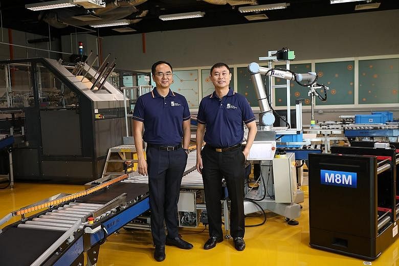 (From left) Dr David Low, chief executive of A*Star's Advanced Remanufacturing and Technology Centre, and Professor Tan Sze Wee, assistant chief executive of A*Star's Science and Engineering Research Council. ST PHOTO: ONG WEE JIN