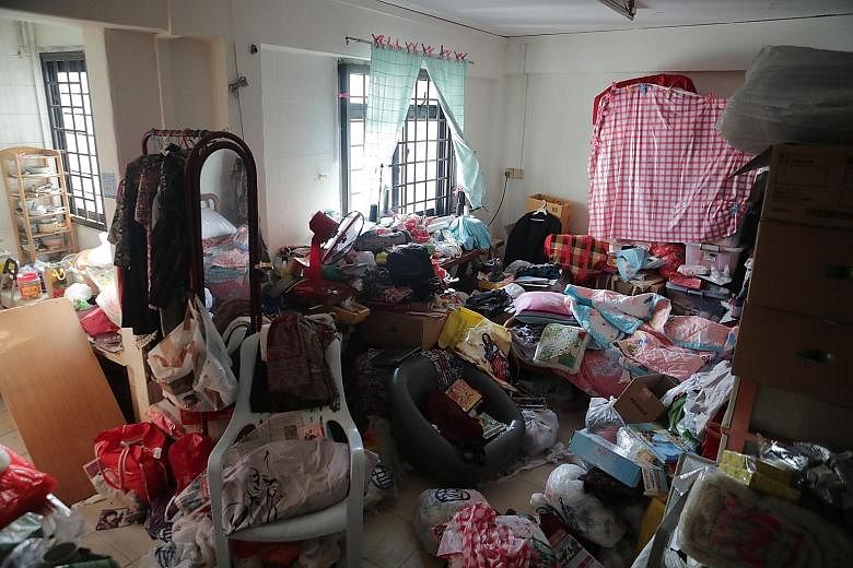 An overjoyed Madam Leong taking in the state of her home when the volunteers from non-profit group Keeping Hope Alive had finished their work of cleaning up. She says she is thankful that she now has the space to invite her friends over for karaoke a