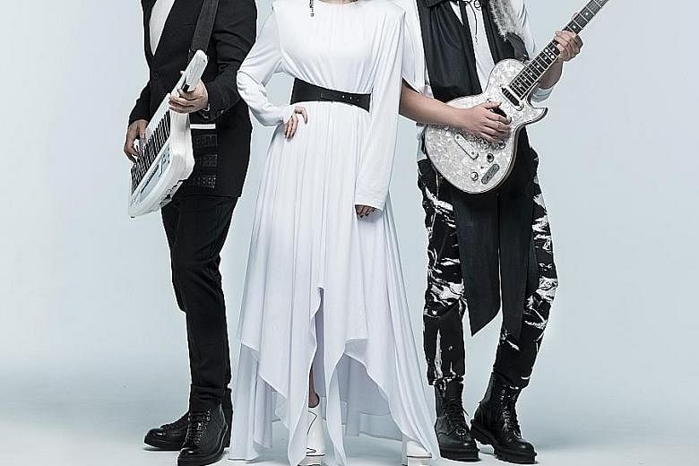 F.I.R. new lead vocalist Lydia Han with band members Ian Chen (left) and Real Huang (right).