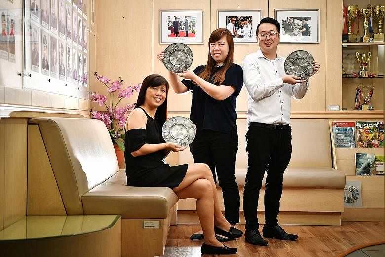 (From left) DBS Bank teller Sally Tay, OCBC Bank customer service manager Kristie Chiang and OCBC Bank teller Alson Ong helped to prevent their customers from getting scammed. The trio were among nine who received public spiritedness awards at Bedok 