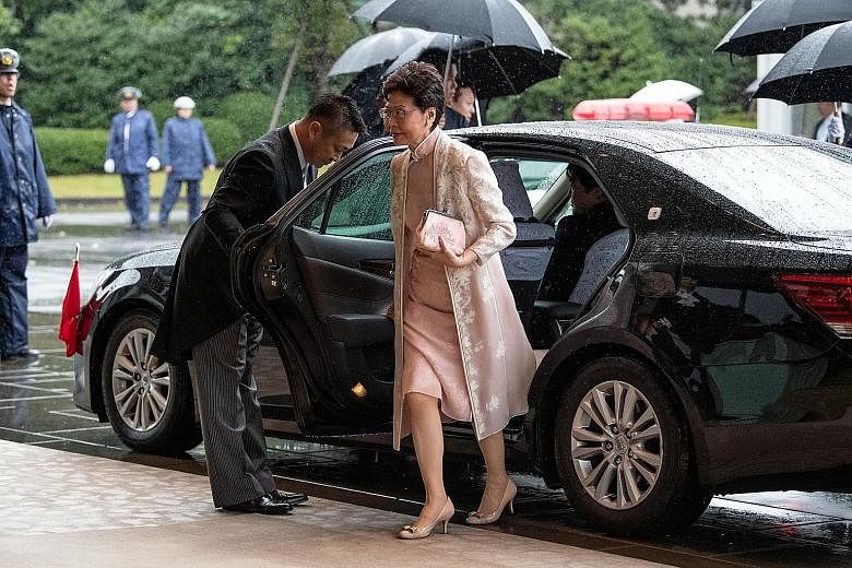 Hong Kong Chief Executive Carrie Lam arriving in Tokyo on Tuesday to attend the enthronement ceremony of Japan's Emperor Naruhito. China has said that it supports Mrs Lam's efforts in putting an end to the violence and chaos in Hong Kong and restorin