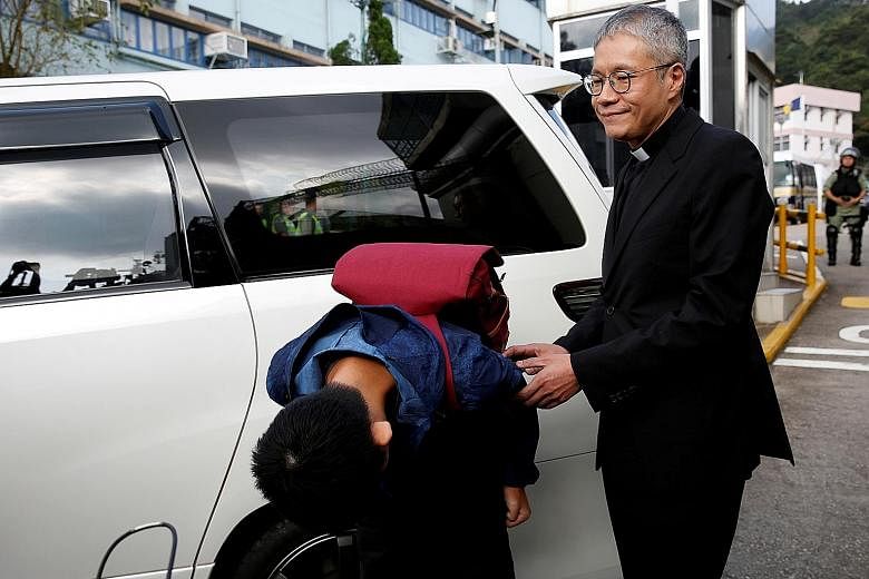 Chan Tong Kai (above), a Hong Kong citizen accused of murdering Ms Poon Hiu Wing in Taiwan, bowing in apology to his girlfriend's family after he was freed from prison. PHOTOS: REUTERS