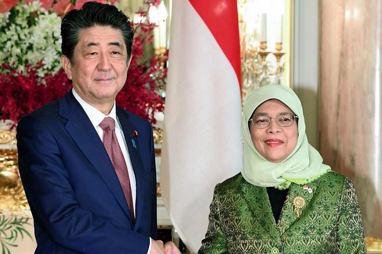 President Halimah with Japanese Prime Minister Shinzo Abe at the Akasaka State Guest House in Tokyo yesterday. Madam Halimah was among the heads of state and royalty from about 180 countries who attended Emperor Naruhito's coronation on Tuesday. PHOT