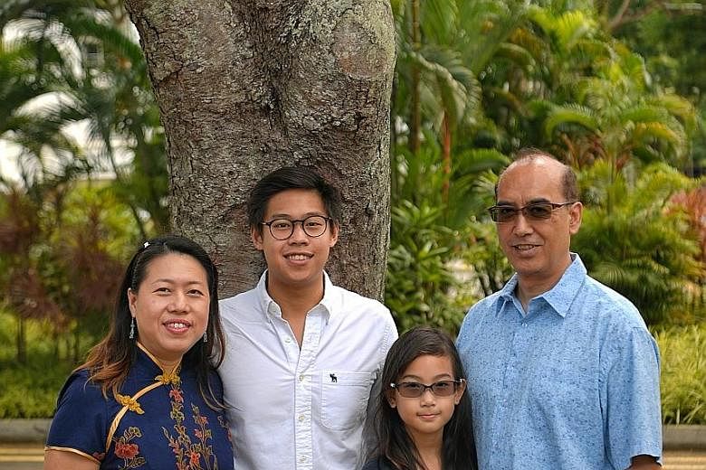 Mrs Honey Tan-Vreugdewater, 47, and her Dutch-Indonesian husband John Vreugdewater, 57, went with Chinese as a second language for their children Russell, 23, and Charlotte, 10. ST PHOTO: MARK CHEONG