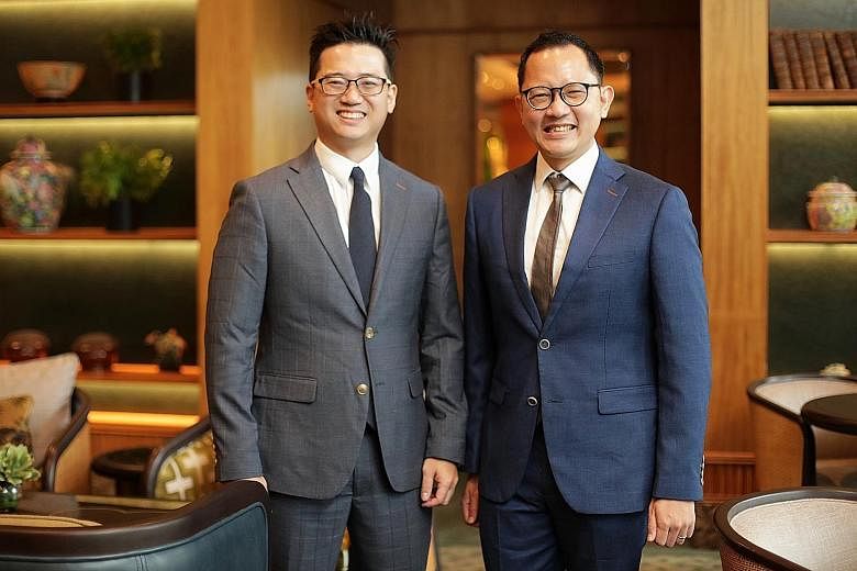 Mr Gilbert Ng (left) of Hwa Chong Institution and Mr Koh Weining of Temasek Junior College received the Outstanding Economics Teacher Award, given by the Economic Society of Singapore, at the 12th Singapore Economic Policy Forum held at the Regent Si
