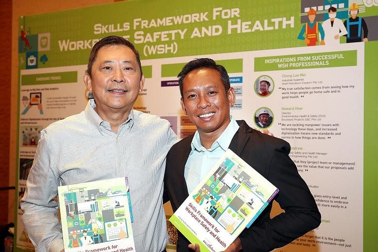 Workplace safety and health director Howard How (left) and health, safety, security and environmental coordinator Muhamad Ithnin are among those who welcomed the new Skills Framework for Workplace Safety and Health, which was announced yesterday.