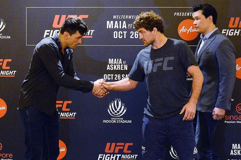 Brazilian Demian Maia (far left) and American Ben Askren meeting during media day yesterday, before they face off tomorrow at UFC Fight Night Singapore at the Indoor Stadium. ST PHOTO: KELLY HUI