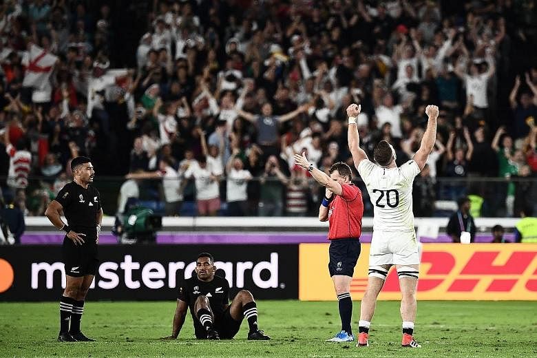 England's back row Mark Wilson (No. 20) rejoices, while New Zealand's fly-half Richie Mo'unga (left) and wing Sevu Reece are crestfallen after the World Cup semi-final at the International Stadium Yokohama.