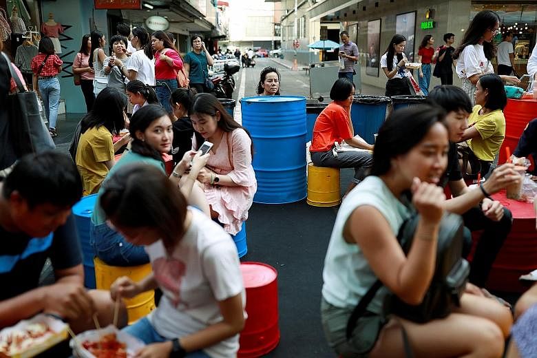 A street market in Bangkok. A stimulus plan launched by Thailand's government aims to get citizens to help boost the flagging tourist industry.