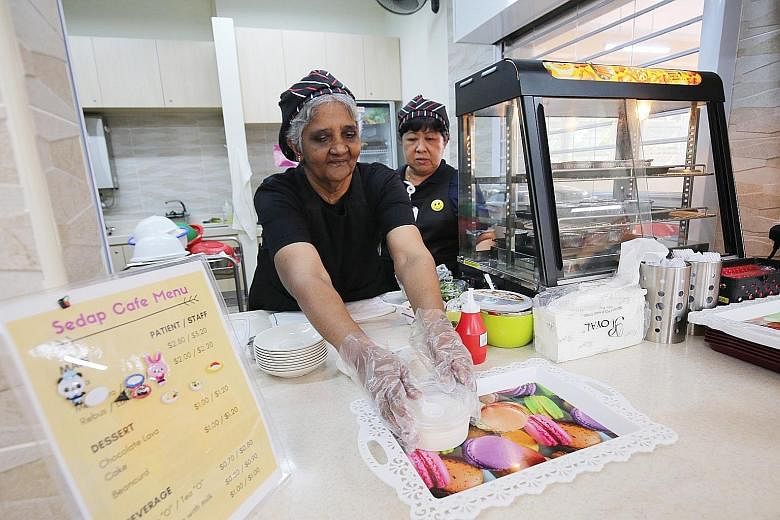 Madam Malliga working at the Sedap Cafe at the Institute of Mental Health. The 62-year-old, who has schizophrenia, has been a patient there since 2011. The cafe, which was opened by Punggol East MP Charles Chong yesterday, is currently run by six IMH
