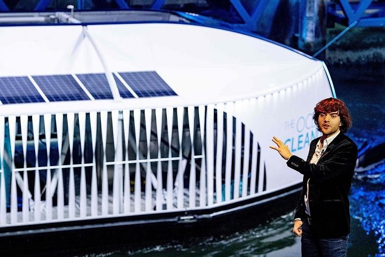 Mr Boyan Slat, founder of Ocean Cleanup, during a presentation of his group's floating garbage collection barge in Rotterdam last Saturday. The system, called the Interceptor, is said to be capable of scooping thousands of kilograms of trash a day fr