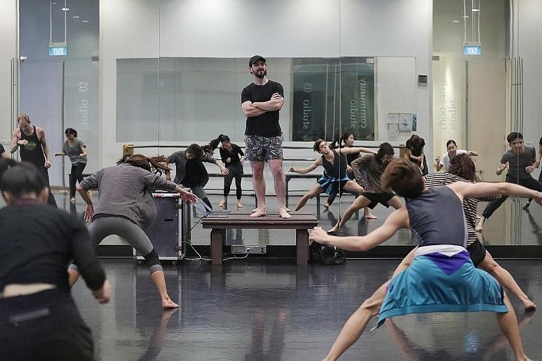 Australian choreographer Lucas Jervies (centre) at a studio rehearsal for Family Reunion at the Singapore Dance Theatre.