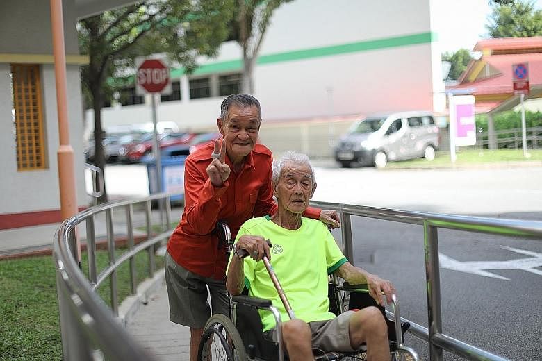 Mr Lee Cho Poon with Mr Neo Cheng Liang, who uses a wheelchair. For years, Mr Lee has opened his heart and home to a few of his fellow seniors, caring for them like they are his family members. His current housemate, Mr Neo, who has dementia and is h