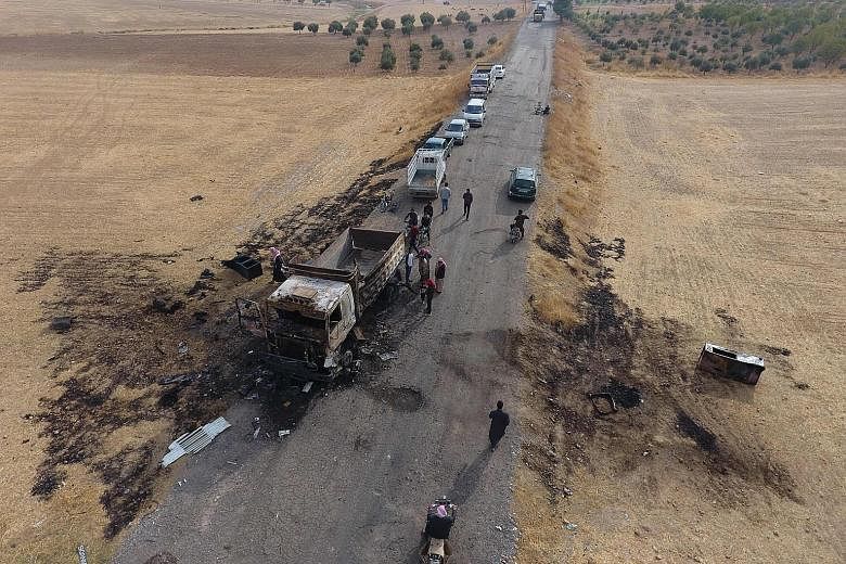 A destroyed truck at the spot where ISIS spokesman Abu Hassan al-Muhajir was reportedly killed in a raid in the northern Syrian village of Ayn al-Bayda. He was the right-hand man of late ISIS leader Abu Bakr al-Baghdadi, who died in a US raid. PHOTO:
