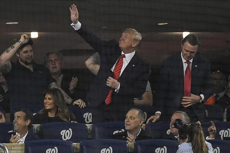 US President Donald Trump at a World Series baseball game in Washington on Sunday. In his presidential address, he described the raid that led to ISIS leader Abu Bakr al-Baghdadi's death in graphic terms.