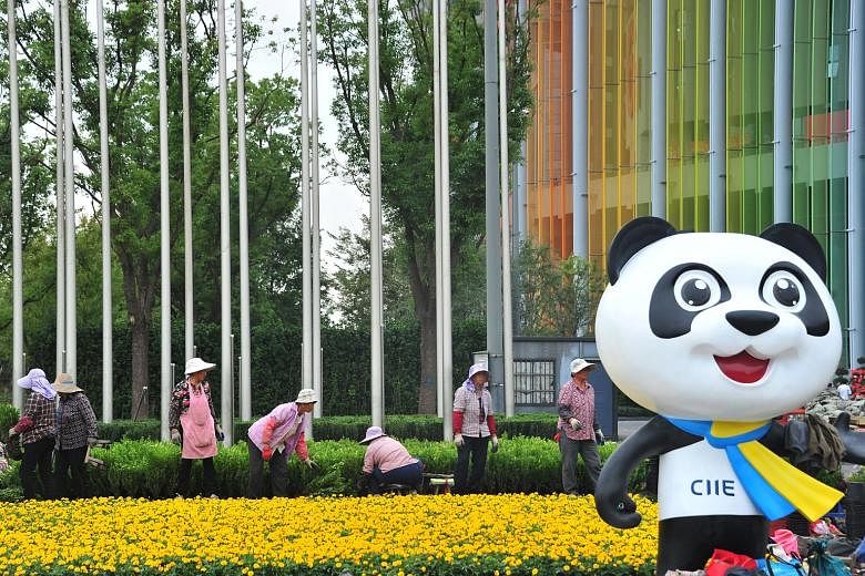 Women working on a garden last week at the venue for the upcoming second China International Import Expo in Shanghai. Chinese officials said this year's fair will be larger than last year's, which attracted over 3,600 companies from 172 countries and