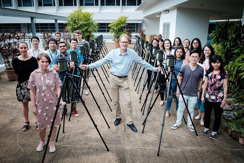 Singapore Centre for Environmental Life Sciences Engineering research director Stephan Schuster with air sample collectors and his team of researchers who worked on the study of the atmosphere in the tropical region to understand what we inhale and h
