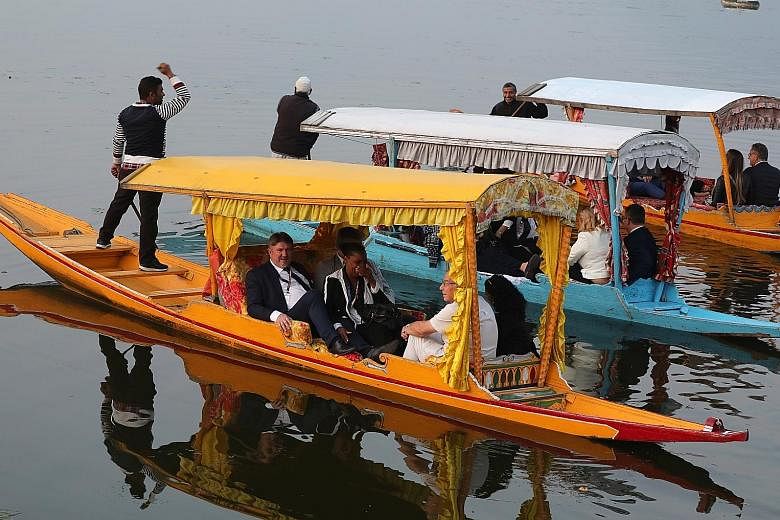 Some members of an EU delegation, comprising parliamentarians from mainly far-right parties, during a boat ride on Dal Lake in Srinagar on Tuesday. It is the first visit by an international delegation to Jammu and Kashmir since the government of Indi