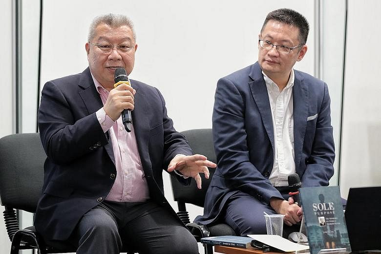 Author and historian Kevin Y.L. Tan (far left) discussing his latest book, Sole Purpose, with Straits Times Press general manager Tan Ooi Boon (left) at a Straits Times Book Club session.
