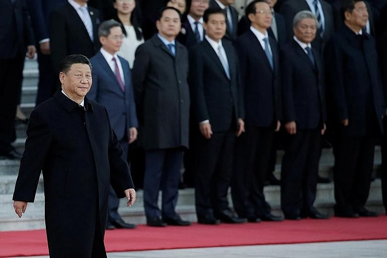 Chinese President Xi Jinping walking past senior officials during a ceremony at the Great Hall of the People in Beijing last month. PHOTO: REUTERS
