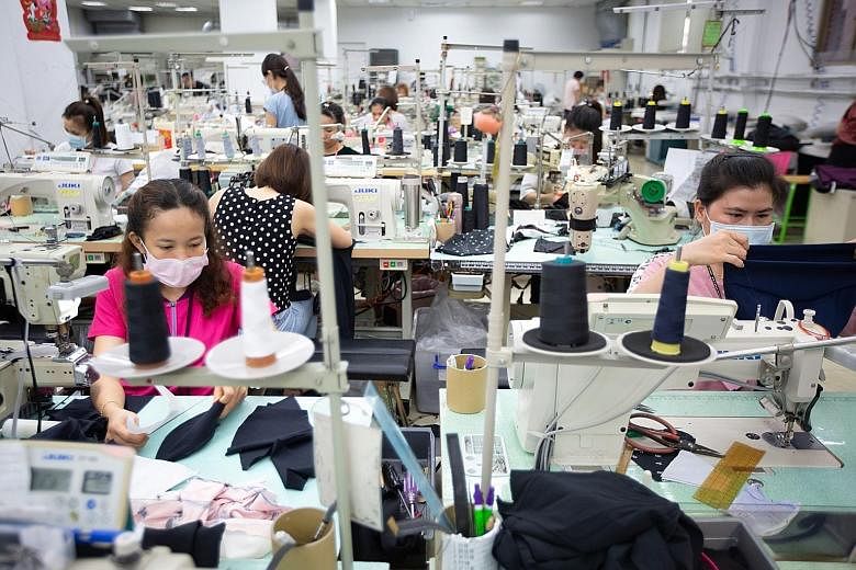 A garment factory in Vietnam. The country stands to gain from the US-China trade war, which has sparked an exodus from China of low value-added production, including textiles. PHOTO: BLOOMBERG