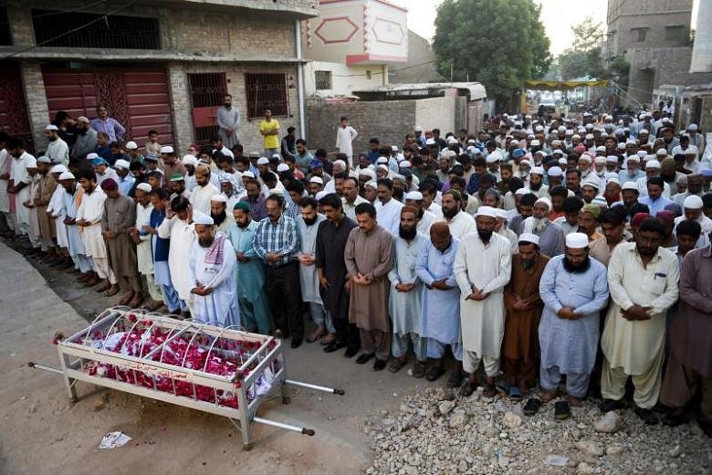 Funerals begin as town mourns victims of Pakistan train fire | The ...