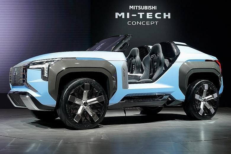 Mitusbishi quad-motor Mi-Tech electric concept buggy. Toyota Mirai hydrogen fuel cell vehicle. Nissan unveiled the electric Ariya concept at this year's Tokyo Motor Show.