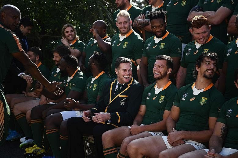 South Africa's coach Rassie Erasmus (centre) and his players look relaxed in a photo session at the team's hotel in Urayasu near Tokyo yesterday, ahead of today's World Cup final against England. PHOTO: AGENCE FRANCE-PRESSE
