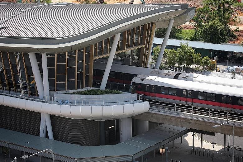 The elevated Canberra MRT station is the first where residents connect directly to the ticketing platform from an overhead bridge, said Transport Minister Khaw Boon Wan. The bridge is lined with shops and connected to Canberra Plaza at the other end.