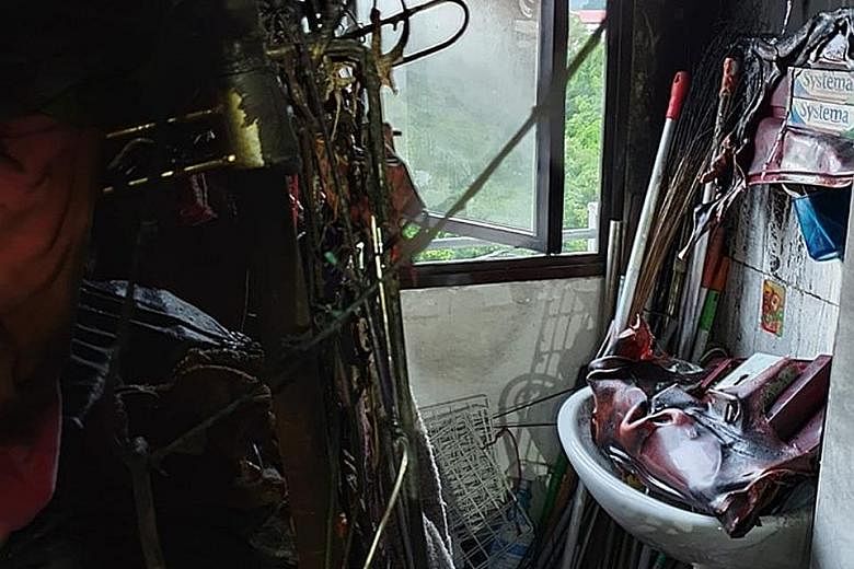 The fire in the flat in Bukit Batok (above), which began after 4am yesterday, left the charred remains (right) of household appliances and belongings in mounds that reached nearly to the ceiling. PHOTOS: SHIN MIN, SCDF/FACEBOOK