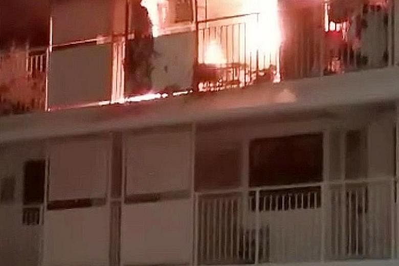 The fire in the flat in Bukit Batok (above), which began after 4am yesterday, left the charred remains (right) of household appliances and belongings in mounds that reached nearly to the ceiling. PHOTOS: SHIN MIN, SCDF/FACEBOOK