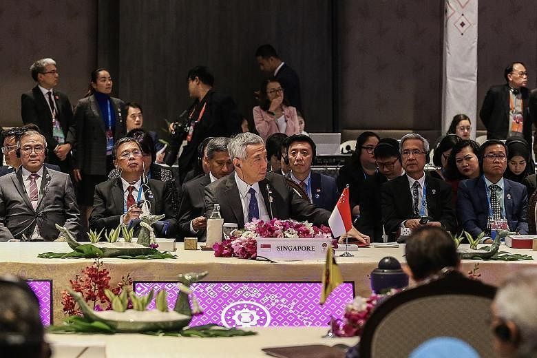 Prime Minister Lee Hsien Loong at the 35th Asean Summit plenary session in Bangkok yesterday. PM Lee urged fellow leaders of all 10 South-east Asian nations to deepen cooperation among members of the bloc in order to counteract challenges such as hea