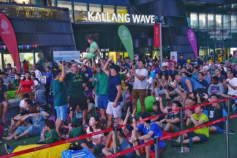 South Africa fans celebrate outside the Kallang Wave Mall. 