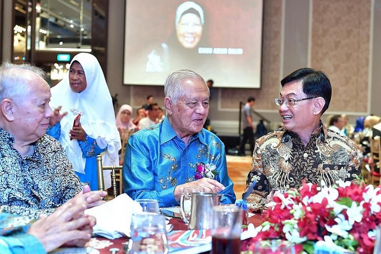 Deputy Prime Minister Heng Swee Keat with former Sang Nila Utama Secondary School (SNU) principal Muhammad Jaafar (far left) and former MP Wan Hussin Zoohri at a reunion yesterday for alumni and former teachers of SNU and Tun Seri Lanang Secondary Sc